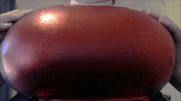 Still from clip titled Boobie Camp: Shiny Wrapped Addiction